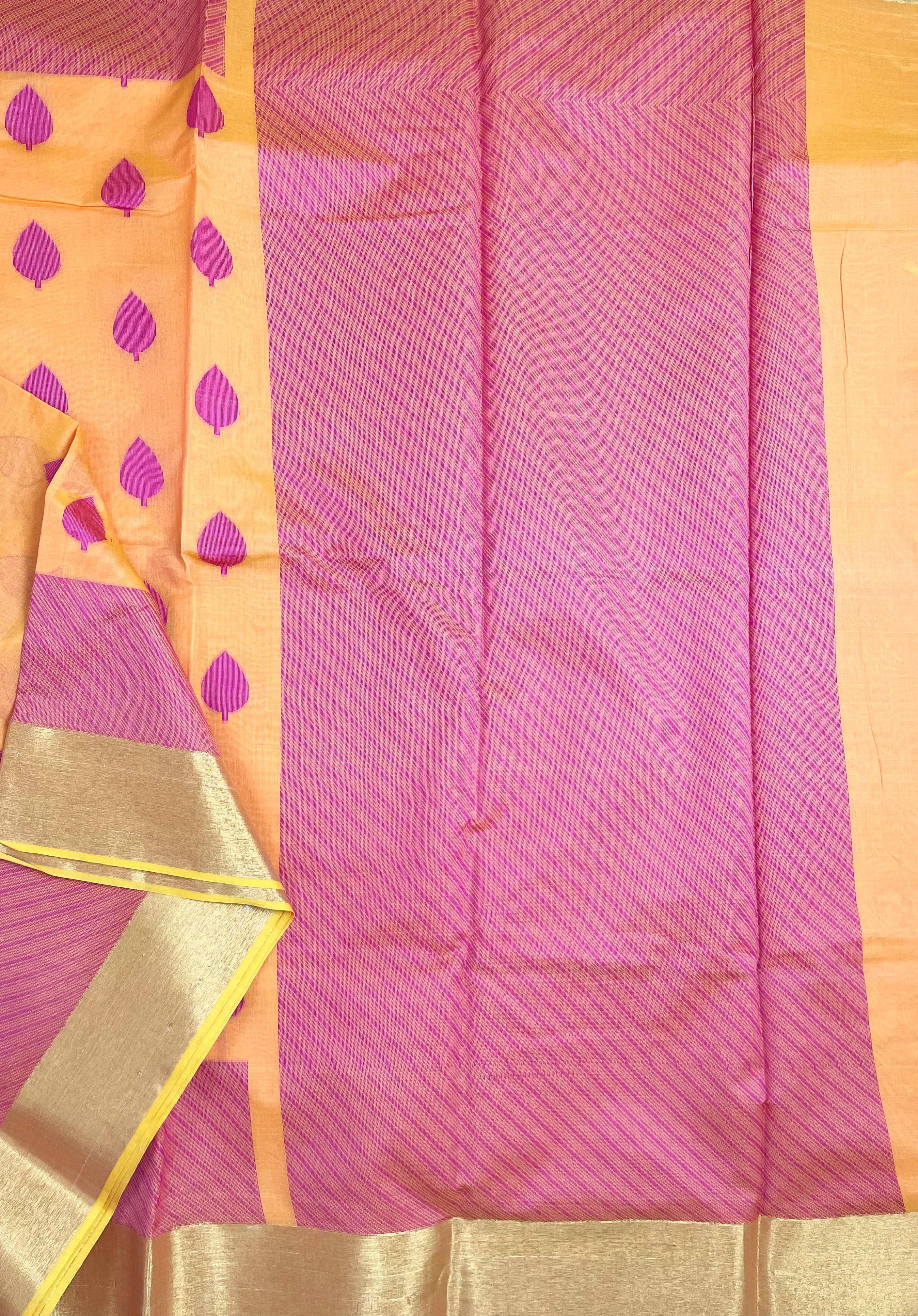 Apricot shade saree with magenta buttas