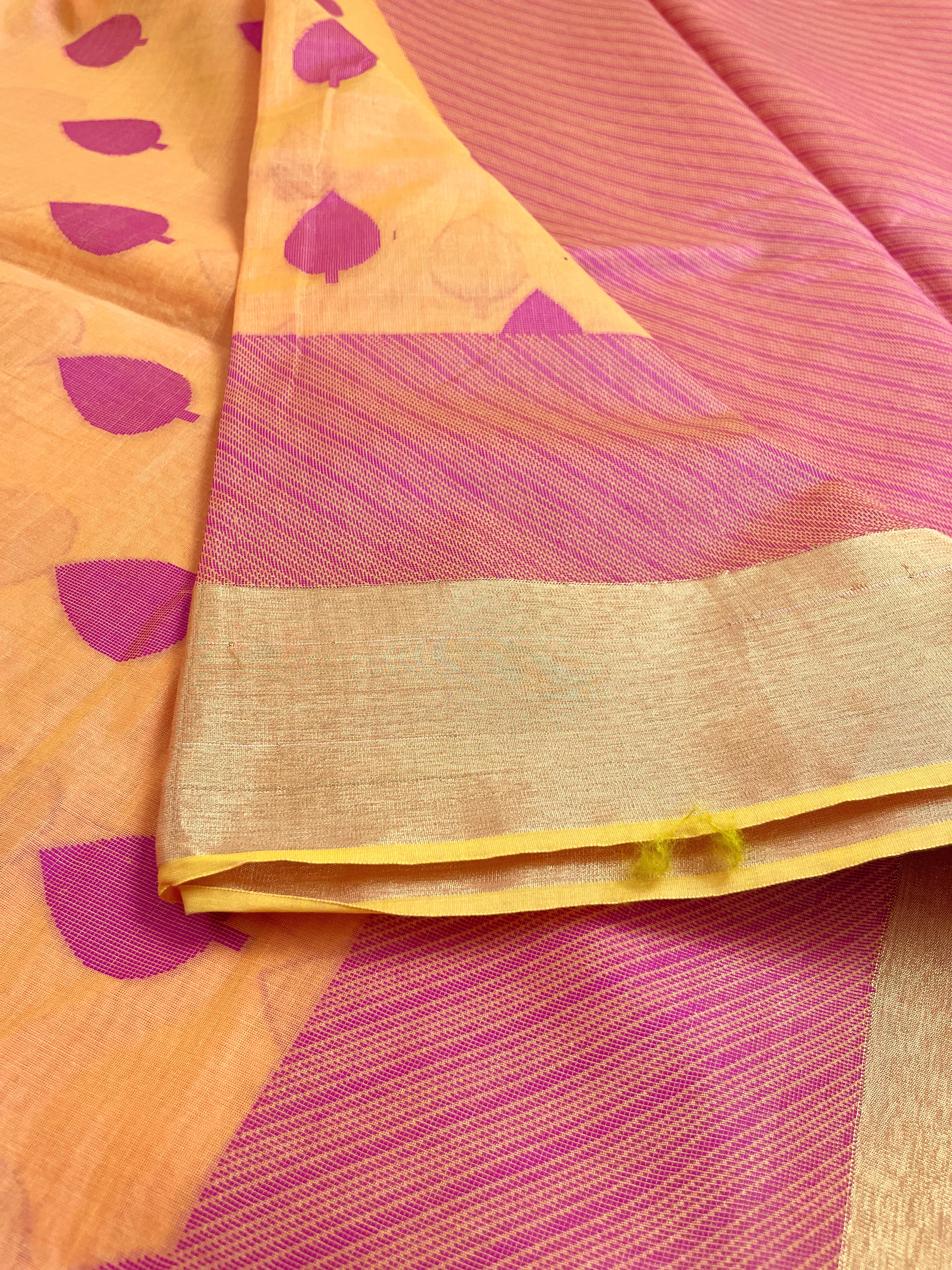 Apricot shade saree with magenta buttas