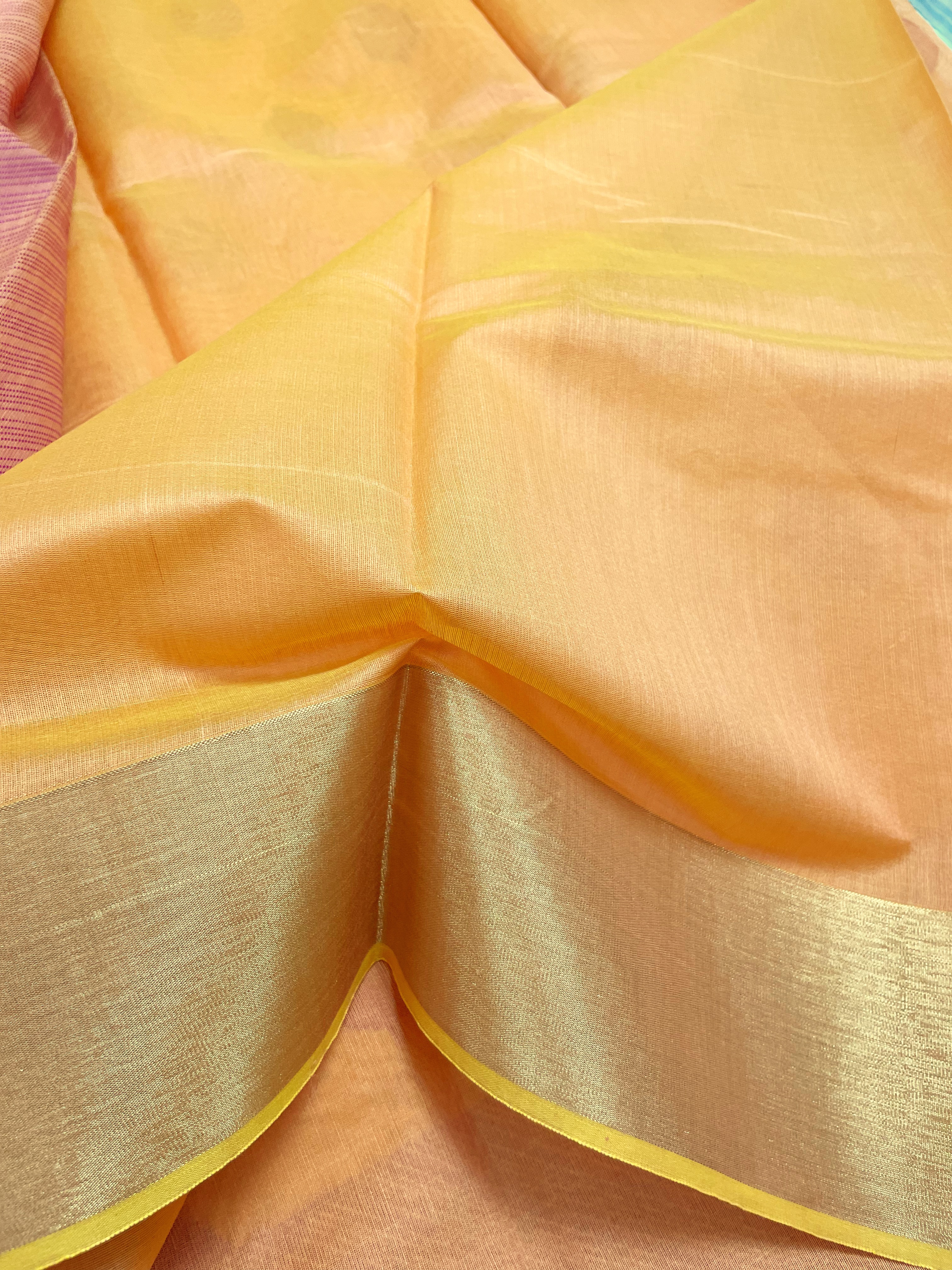 Apricot shade saree with magenta buttas