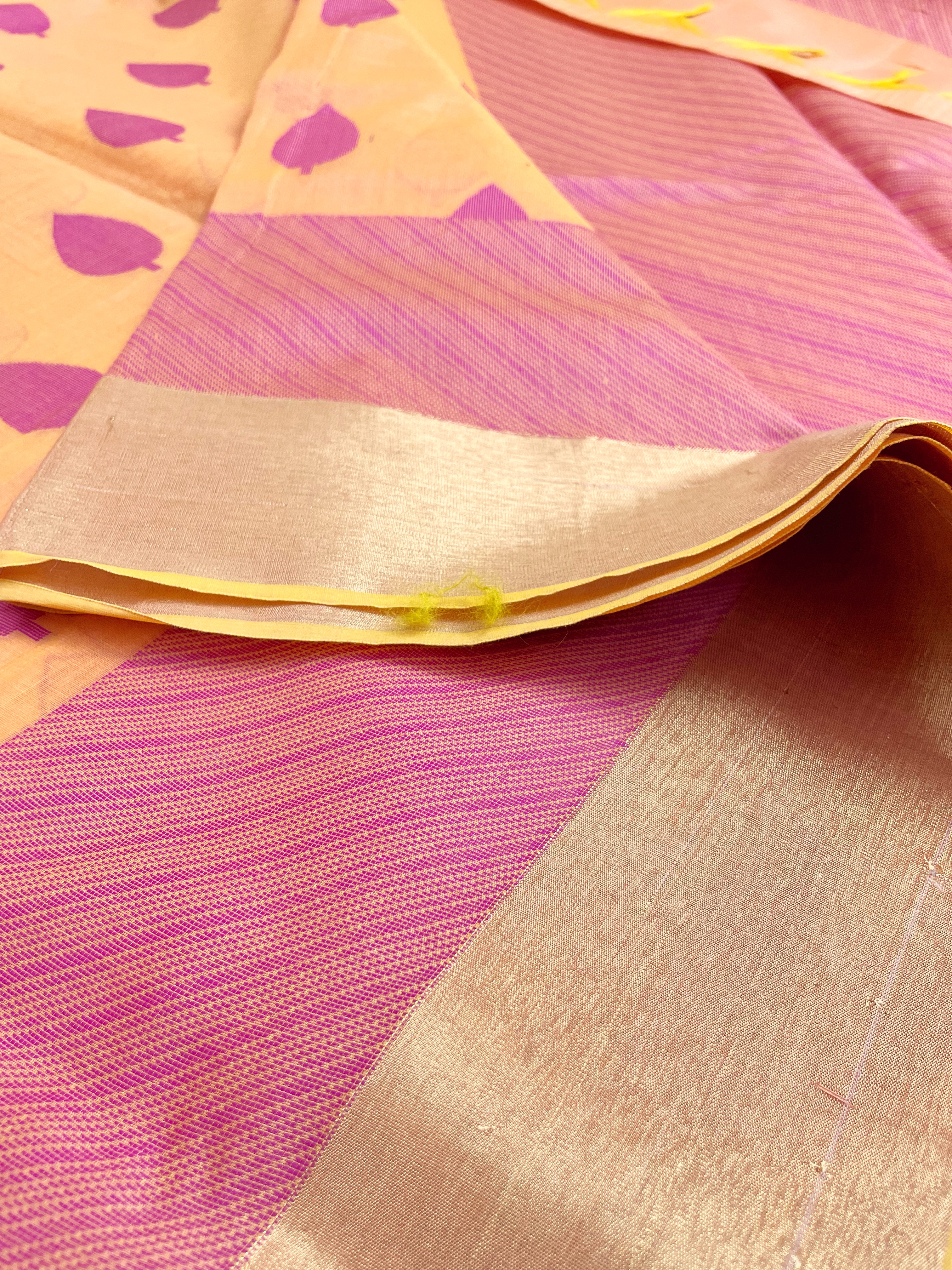 Apricot shade saree with magenta buttas
