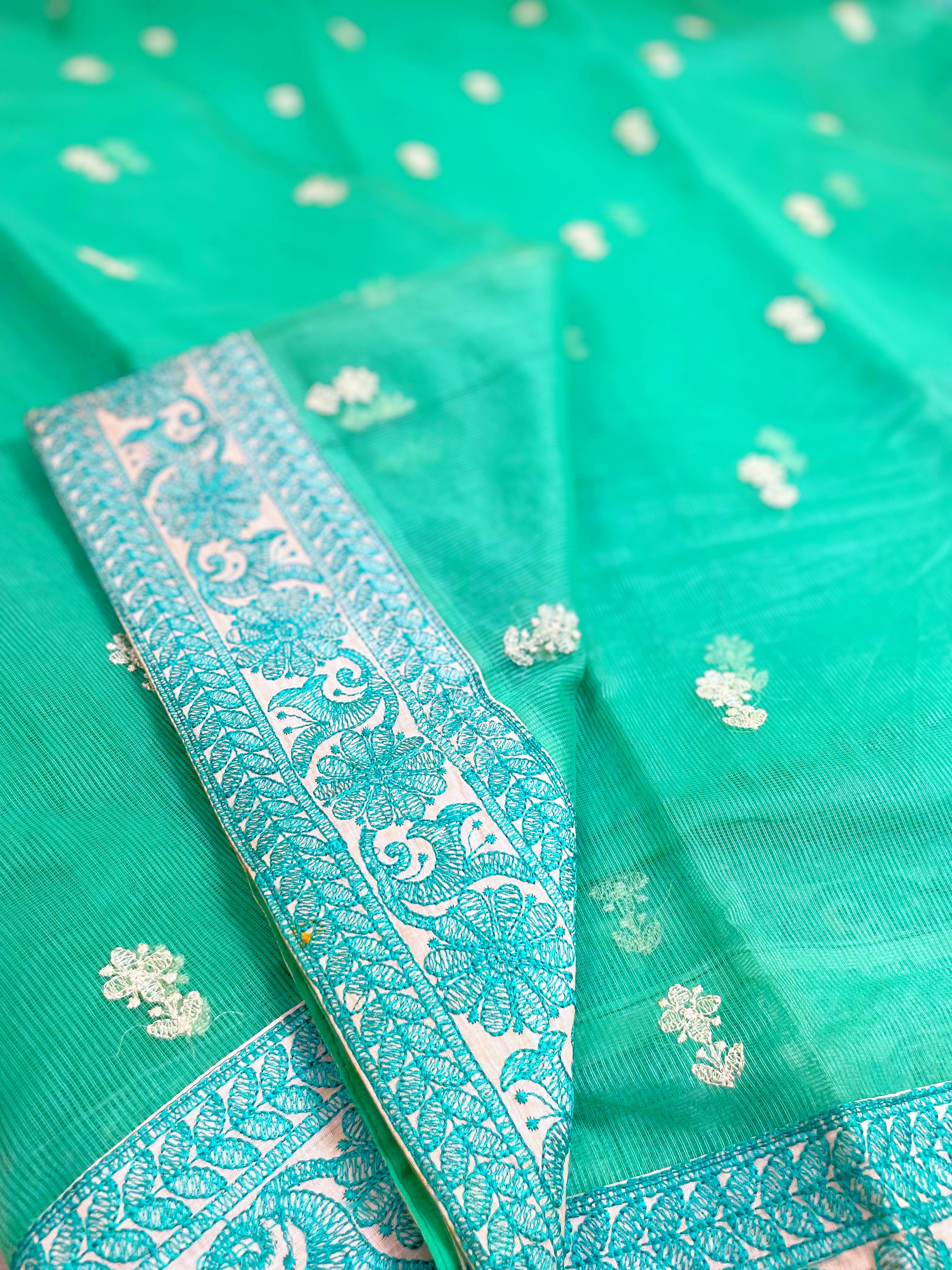 A green supernet saree with embroidery