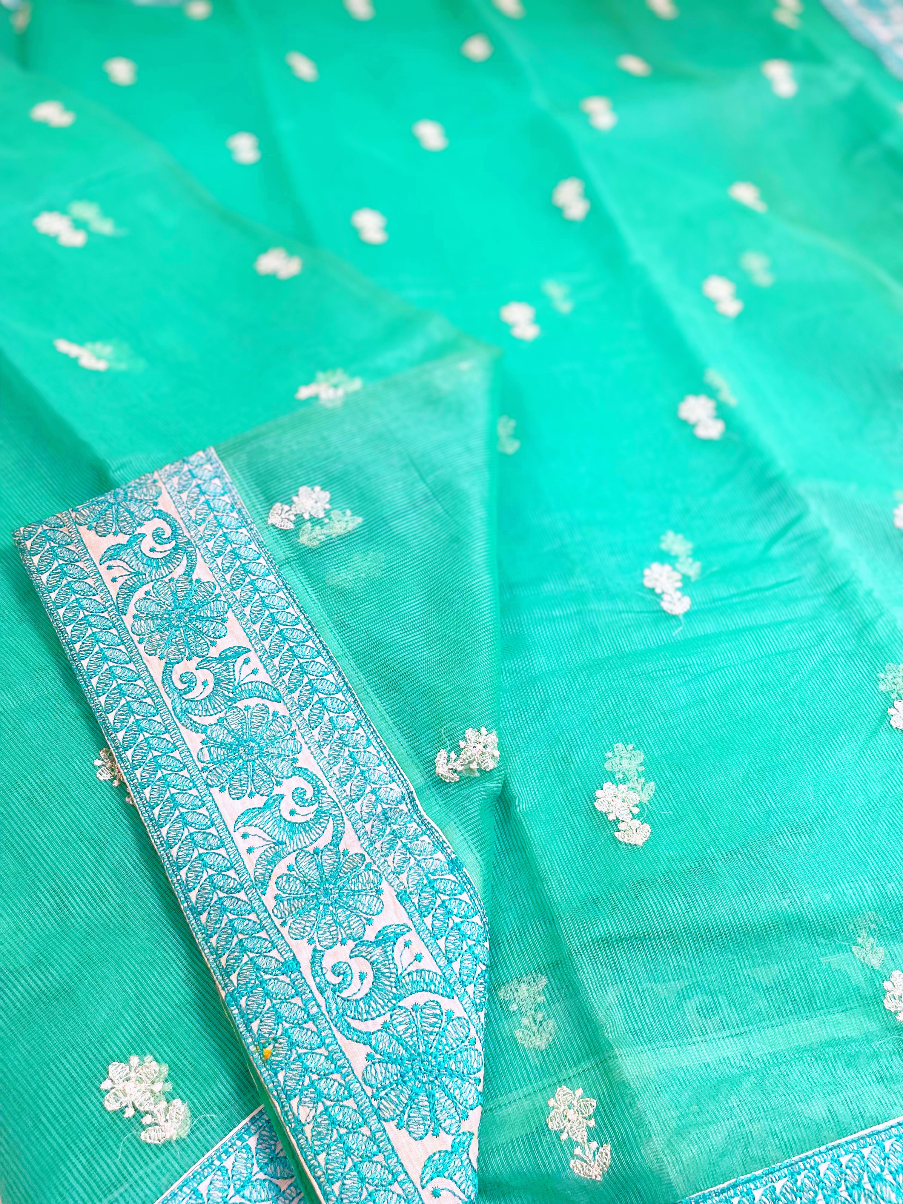 A green supernet saree with embroidery